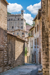 Wall Mural - Scenic sight in Gubbio with Palazzo dei Consoli, medieval town in the Province of Perugia, Umbria, central Italy.