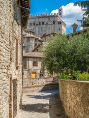 Wall Mural - Scenic sight in Gubbio with Palazzo dei Consoli, medieval town in the Province of Perugia, Umbria, central Italy.