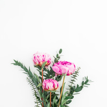 Bouquet Of Pink Peonies, Hypericum And Eucalyptus On White Background. Flat Lay, Top View