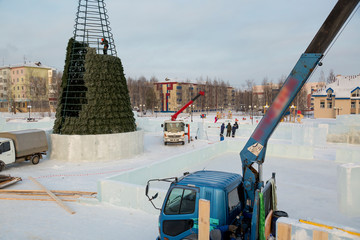 Workers on the installation of the ice town