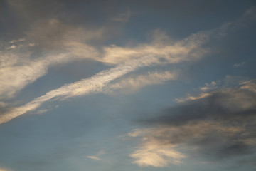 The sky background as the image. Abstract clouds and sky. The best images of heaven with clouds.  Evening sunset. The sun's rays illuminate the clouds.