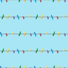 Seamless Pattern Colored Clothes Pins On A Clothes Line Rope On Blue Background .