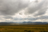Fototapeta Na ścianę - Mongolian steppe, beautiful landscape with cloudy sky.