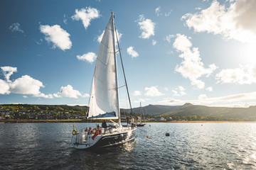 tourists on the sailing yacht. northern ireland. breathtaking marine scenery. the lone boat on the w