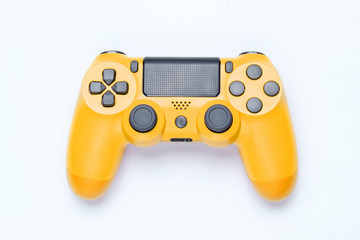 Wall Mural - modern yellow gamepad (joystick) on gray background. top view.