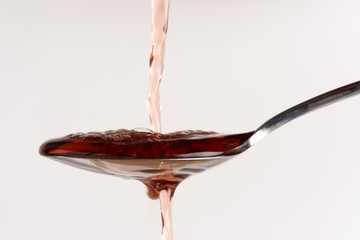 Pouring Red Wine Vinegar on a Spoon