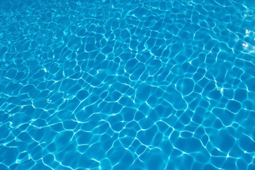   Rippled pattern of blue clean water in a  swimming pool.