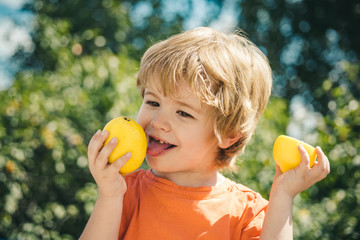 Cute child and lemon. Citrus fruits and vitamin C for health. Good health and strong children immunity. Vaccinations and healthy eating