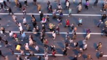 Top View Of People Walking. Crowd Of People On Street. Defocused Footage.