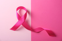 Pink Ribbon And Space For Text On Color Background. Breast Cancer Awareness Concept