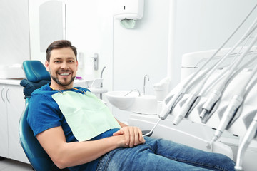 Sticker - Happy man having dentist's appointment in modern office