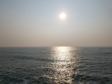 Sun With Reflection Over Ocean Or Sea Water