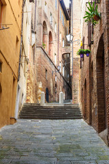 Medieval narrow street in Siena, Tuscany, Italy.