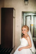 © Aleksandr - Morning of beautiful woman. Wedding day. Bride in white dress. Wedding dress. Bride dressed in hotel