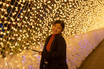 Wall Mural - Giant led light tunnel is the famous place in Nabana No Sato, Nagasima, Japan. Many tourists sightseeing walking and taking a picture