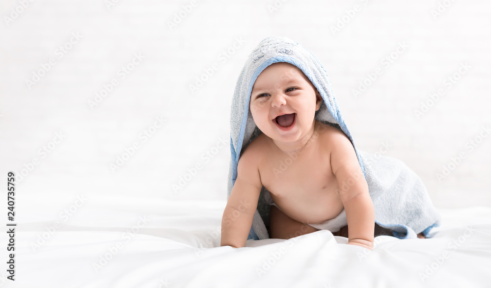 Cute little baby boy in hooded towel after bath - obrazy, fototapety, plakaty 