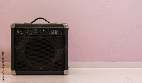Cuadros en Lienzo portable electric guitar amplifier isolated in front of a stone wall, music equi
