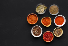 Colourful Spices In Bowls On Black Background
