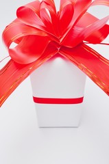 Christmas and New Year's Day , red ribbon gift box on white background