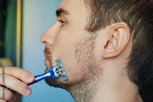 Photo Of Masculine Brunette Guy With Dark Short Hair Shaving His