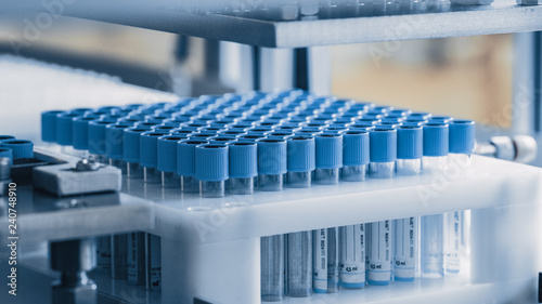 Fotografía Close-up Shot of the Industrial Manufacturing Medical Test Tubes, Closing Caps put on Tubes