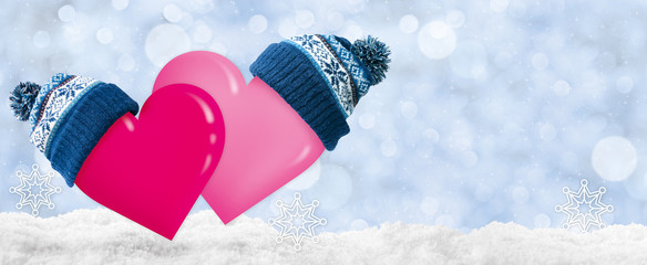 Two hearts in the winter caps for the Valentine's Day