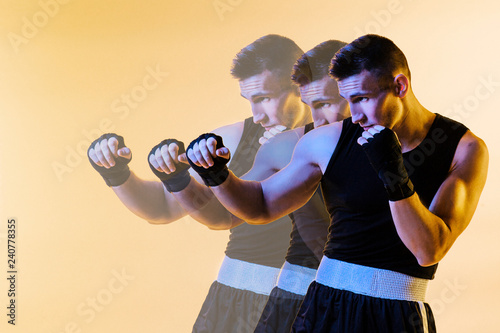 Fotografie, Tablou  three dimensional portrait of a mixed martial arts fighter in defense position