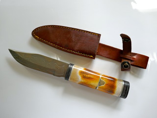 Knife, hunting knife with deer horn handle and leather sheath