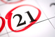 © bisonov - Red circle marked with pen on a calendar sheet 21 date