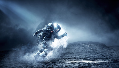 Wall Mural - Spaceman running fast. Mixed media