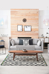 Poster - Stylish living room interior with comfortable couch and decorative elements