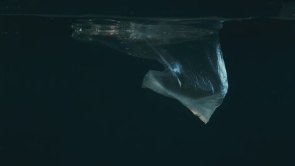 Wall Mural - plastic bag in water, pollution environmental problem concept