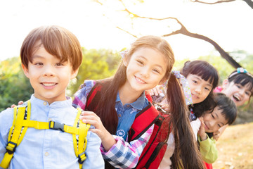 Wall Mural - happy Multi-ethnic group of schoolchildren in park