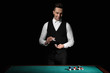 © Pixel-Shot - Handsome male banker at table in casino