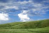 Fototapeta Tęcza -  green mountain and blue sky with clouds