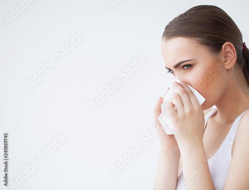 Fotografía Woman Suffering From Cold In Home With Tissue