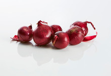 Red Onions On White Ground
