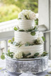 canvas print picture - Three tiered wedding cake with buttercream icing and flowers