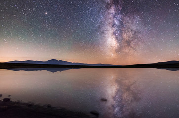 Small lake and milky way galaxy. Beautiful starry night. Armenia