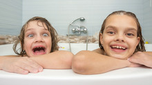 Two Sisters Bathe In The Bath And Make Fun Faces