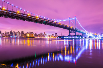 Fototapete - View of RFK Triborough Bridge from Astoria Queens towards Roosevelt Island and Manhattan New York City seen at night