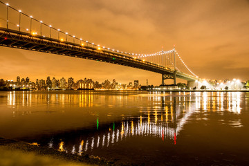 Fototapete - View of RFK Triborough Bridge from Astoria Queens towards Roosevelt Island and Manhattan New York City seen at night