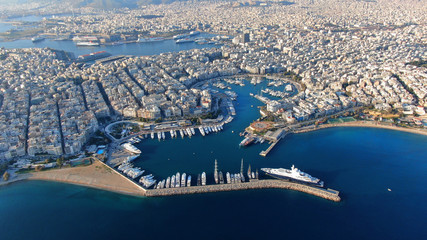 Aerial drone panoramic photo of famous port and Marina of Zea with luxury yachts docked as seen from great height at sunset, Piraeus, Attica, Greece