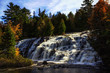Bond Falls waterfall in Michigan's Upper Peninsula. Spectacular autumn waterfall background with copy space.