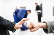 © Miljan Živković - hand bump at the brazilian Jiu Jitsu sparring