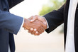 © digitalskillet1 - Mature African American casually dressed businessman shaking hands.