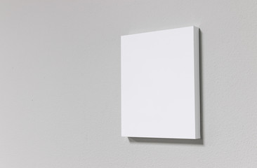 Poster - White picture frame on cement wall. Modern gallery in simple style.