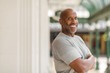 © digitalskillet1 - Happy mature African American man smiling outside.