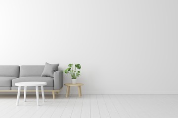 Poster - Minimal concept. interior of living grey fabric sofa, wooden table on wooden floor and white wall.