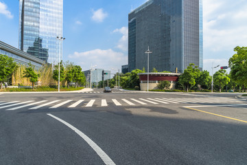 Wall Mural - empty asphalt road front of modern buildings.